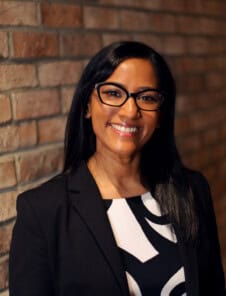 Women Headshot on brick wall