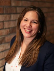 Women Headshot on brick wall